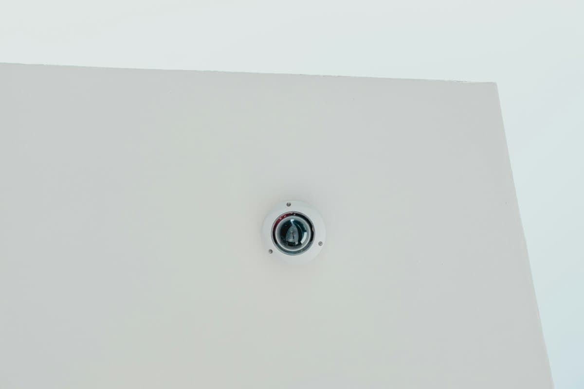 Dome-style outdoor security camera mounted on an exterior wall