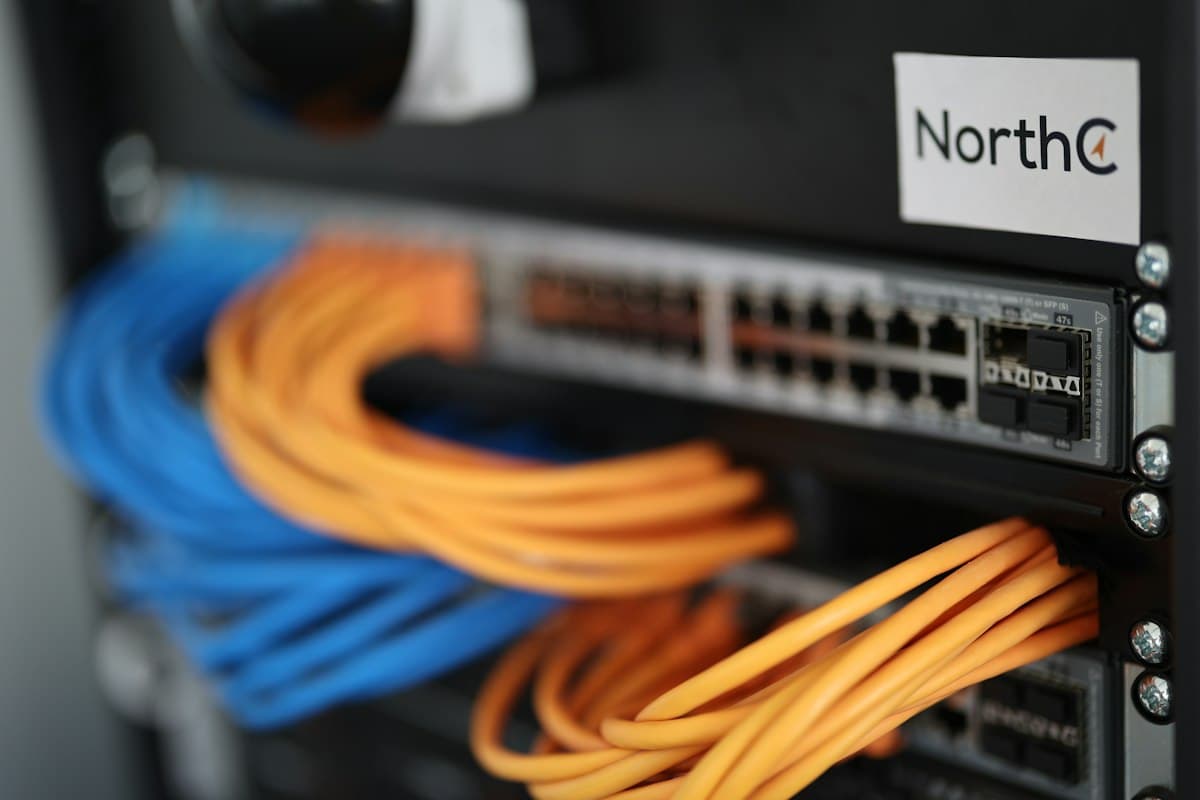 Close-up of a PoE network switch with Ethernet cables connected